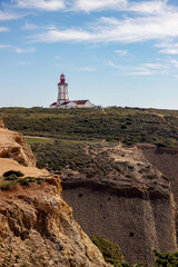 landscape of Cape Espichel Lighthouse on cliff in Sesimbra, Portugal - 768819750