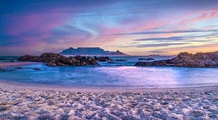 Picturesque view of Table Mountain in South African glowing in the golden light of a sunset © Wirestock