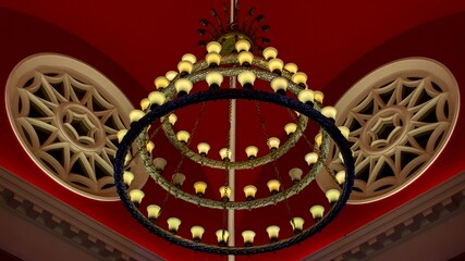 Circular light fixture with decorative elements suspended from the ceiling