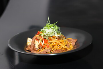 pasta with sauce And grilled meat With vegetables 