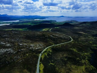 Aerial view of a scenic landscape with a peaceful sea on west coast of Ireland