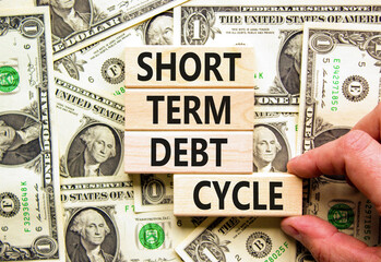 Short term debt cycle symbol. Concept words Short term debt cycle on beautiful wooden block....