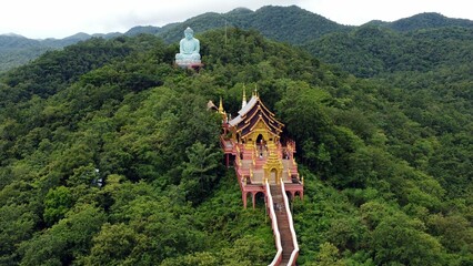 Aerial view of the Great Buddha statue of Wat Doi Phra Chan at the Buddhist temple in Thailand