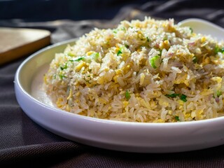 White plate with nutritious Yangzhou fried rice.