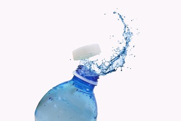Closeup of a The blue liquid being splashed in the air from a bottle with a white background