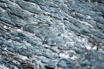 Of an arid, rocky terrain with distressed surface texture
