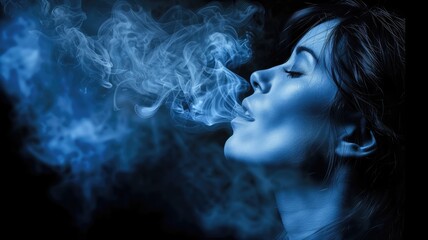 Woman exhaling blue smoke in a mystical manner - obrazy, fototapety, plakaty