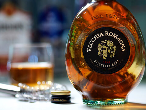 In this photo illustration, a bottle of  Vecchia Romagna Etichetta Nera brandy seen displayed on a table.