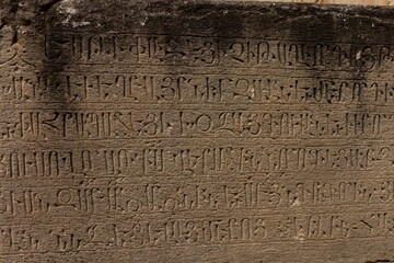 Old Armenian stone tablet featuring a weathered and faded inscription