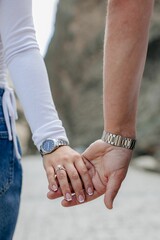 Couple showcasing a woman's engagement ring.