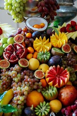 Naklejka na ściany i meble Colorful array of fresh fruits arranged on a platter