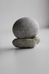 Fototapeta na wymiar Equilibrium Concept Image. Smooth Round Stone On Another Porous Stone