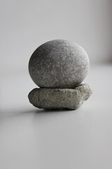 Equilibrium Concept Image. Smooth Round Stone On Another Porous Stone