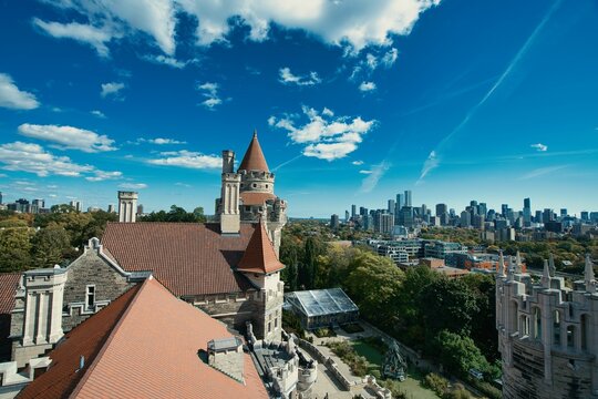 Areal shot of the Casa Loma in Canada Toronto surrounded by other tall buildings
