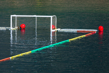 Water polo goal and net on the water. Water sports terrain 