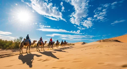 Foto op Plexiglas The group of people riding camels in the desert dunes, backlighting © K'kriang Krai