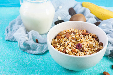 Bowl of granola with nuts, berries and yogurt. Muesli oats with fruits