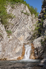 A small mountain waterfall.