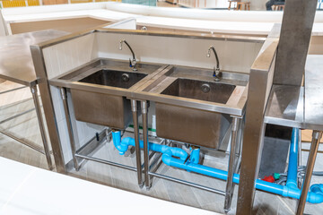 Professional kitchen in a catering establishment, view counter in stainless steel.