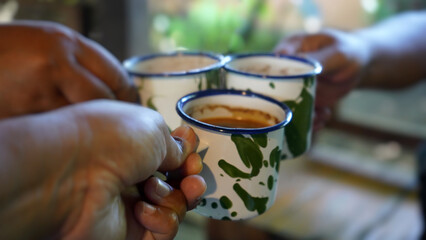 Three people toasting coffee cup in hands. Support friends. Support & kindness. Friendship and...