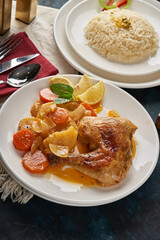 Oven roasted chicken dish with potatoes and white rice
