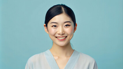 Portrait of a Japanese woman on soft blue background