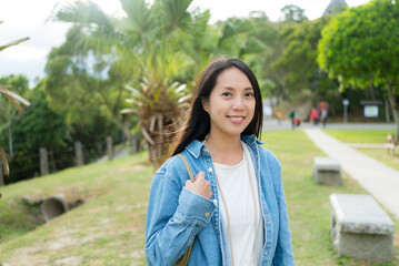 Asian woman smile to camera at park