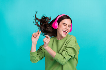 Portrait of carefree excited person closed eyes enjoy song playlist isolated on turquoise color...