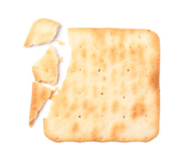 Crispy broken cracker isolated on white, top view