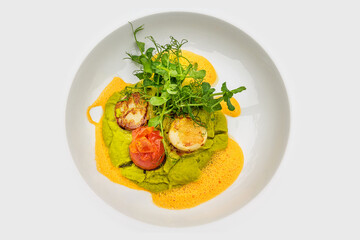 pan-fried scallops on vanilla and pea cream and lobster foam