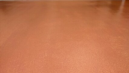 Backdrop of an orange surface.