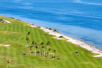 Big golf course field with green grass in Boca Grande, small town on Gasparilla Island in southwest Florida