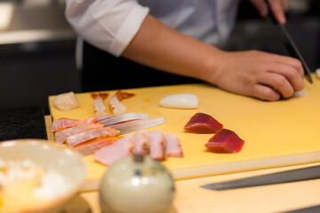 Obraz na płótnie Canvas Japanese chef make of sashimi rice bowl