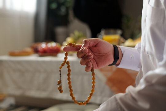 Hand Of Unrecognizable Muslim Man Holding Prayer Beads