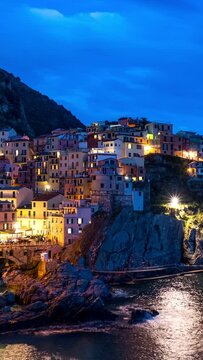 Timelapse of Manarola village popular tourist destination in Cinque Terre National Park a UNESCO World Heritage Site, Liguria, Italy in the evening