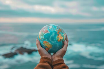 Hands Holding a Globe against Ocean Background