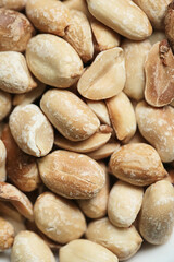 Fototapeta na wymiar Pile of Nuts on White Plate