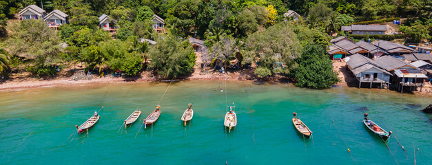 Villagers' fishing boats docked at Koh Lanta, Krabi Province, Thailand. - obrazy, fototapety, plakaty