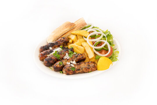 Cypriot Seftalia meal with fries and salad