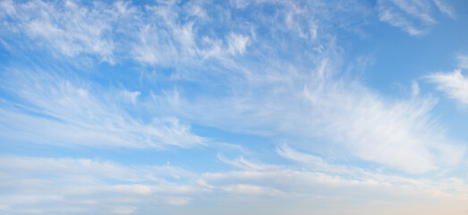 beautiful sky panorama with light feathery cirrus clouds in the atmosphere