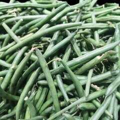 Vibrant close-up image of fresh, green beans piled up