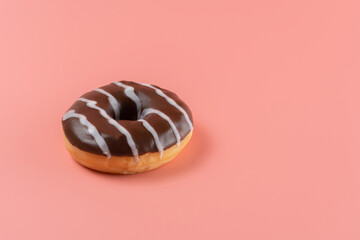 Sweet chocolate donut on bright background.