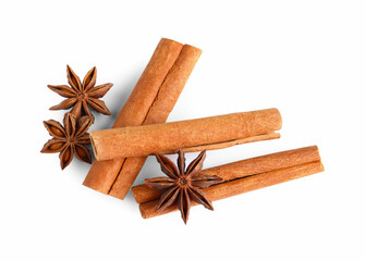 Cinnamon sticks and anise stars isolated on white, top view