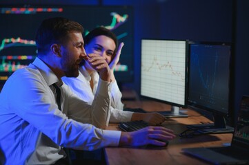 Business team investment working with computer, planning and analyzing graph stock market trading with stock chart data