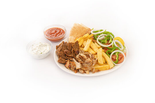 Greek gyros meat meal with french fries and salad