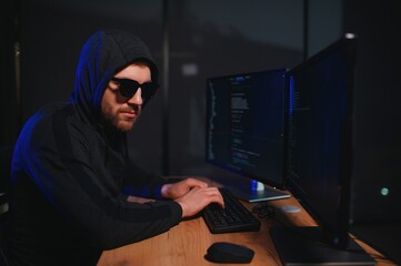 Hacker is hacking into the computer network. Computer criminal