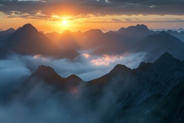 Majestic sunrise over misty mountains with vibrant skies and dramatic landscape.