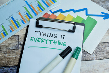 Concept of Timing is Everything write on paperwork isolated on wooden background. stock market concept