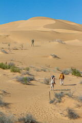 People exploring the dunes in the Sonora desert. Gran Desierto de Altar, Sonora Mexico.