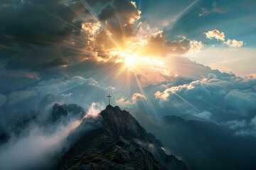 A panoramic view of a mountain peak with a cross, and rays of sunlight breaking through the clouds, the triumph of faith and the promise of redemption. - obrazy, fototapety, plakaty
